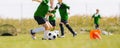 Kids attending soccer training on school field. Children play together on physical education class Royalty Free Stock Photo