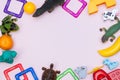 Kids background with colorful toys, frame, on pink backround. Copy space, flat lay, top view Royalty Free Stock Photo