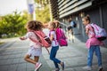 Kids with backpacks run to school Royalty Free Stock Photo