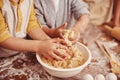 Kids, baking and hands in kitchen with dough, home and learning with ingredients for dessert cake. Children, kneading Royalty Free Stock Photo
