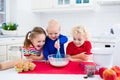 Kids baking a pie in white kitchen Royalty Free Stock Photo