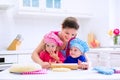 Kids baking in a white kitchen Royalty Free Stock Photo