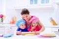 Kids baking in a white kitchen Royalty Free Stock Photo