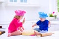 Kids baking in a white kitchen Royalty Free Stock Photo