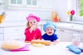 Kids baking in a white kitchen Royalty Free Stock Photo