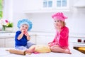 Kids baking in a white kitchen Royalty Free Stock Photo