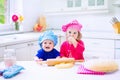 Kids baking in a white kitchen Royalty Free Stock Photo