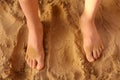 Kids bare feet on sand close up photo Royalty Free Stock Photo