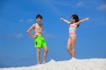 Kids in bathing suits on beach