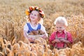 Kids in Bavarian costumes in wheat field Royalty Free Stock Photo