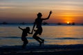 Kids on the beach the dawn time Royalty Free Stock Photo