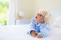 Kids in bed. Children in pajamas. Family bedroom. Royalty Free Stock Photo