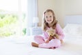 Kids in bed. Children in pajamas. Family bedroom. Royalty Free Stock Photo