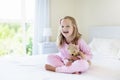 Kids in bed. Children in pajamas. Family bedroom. Royalty Free Stock Photo