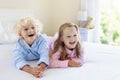 Kids in bed. Children in pajamas. Family bedroom. Royalty Free Stock Photo