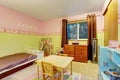 Kids bedroom with pink and green painted walls Royalty Free Stock Photo