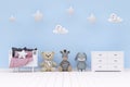 Kids bedroom with stuffed toy animals and cute wall decoration. Royalty Free Stock Photo