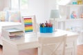 Kids bedroom with wooden desk and doll house Royalty Free Stock Photo