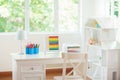 Kids bedroom with wooden desk and doll house Royalty Free Stock Photo