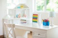 Kids bedroom with wooden desk and doll house Royalty Free Stock Photo