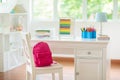 Kids bedroom with wooden desk and doll house Royalty Free Stock Photo