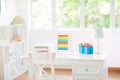 Kids bedroom with wooden desk and doll house Royalty Free Stock Photo