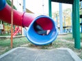 Kids from behind at the playground tunnel slide Royalty Free Stock Photo