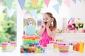 Kids birthday party. Little girl with cake. Royalty Free Stock Photo