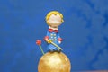 Kids birthday party decoration. Little prince theme party. Closeup of Little Prince in your small planet on blue background