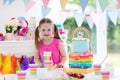 Kids birthday party. Little girl with cake. Royalty Free Stock Photo