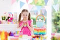 Kids birthday party. Little girl with cake. Royalty Free Stock Photo