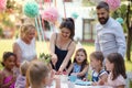 Kids birthday party outdoors in garden in summer, celebration concept. Royalty Free Stock Photo