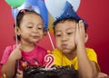 Kids blowing birthday candle Royalty Free Stock Photo