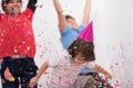 Kids blowing confetti Royalty Free Stock Photo