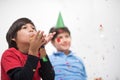 Kids blowing confetti Royalty Free Stock Photo