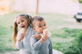 Kids Boy and girl eating ice cream outdoors on grass and trees background Royalty Free Stock Photo