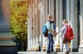 Kids boy and girl go back to school. Brother and sister with backpacks and books going to school after summer vacation Royalty Free Stock Photo