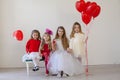 Kids boy and girls with red balloons Royalty Free Stock Photo