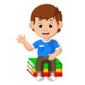 Kids boy sitting on big book Royalty Free Stock Photo