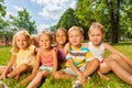 Kids, boys and girls on the lawn in park Royalty Free Stock Photo
