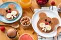 Kids breakfast with pancakes and fruits on a wooden table Royalty Free Stock Photo