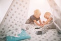 Kids brothers are laying on the floor. Boys are playing in home with toy cars at home in the morning. Casual lifestyle Royalty Free Stock Photo