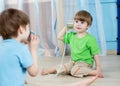 Kids brothers talking with tin can telephone Royalty Free Stock Photo