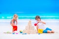 Kids building sand castle on the beach Royalty Free Stock Photo