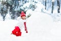 Kids building snowman. Children in snow. Winter fun.