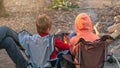 Kids burning a camp fire in the forest Royalty Free Stock Photo