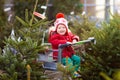 Kids buying Christmas tree Royalty Free Stock Photo