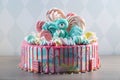 Kids cake decorated with Teddy bear and colorful meringues, marshmallows. Concept of desserts for the birthday children Royalty Free Stock Photo