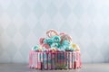 Kids cake decorated with Teddy bear and colorful meringues, marshmallows. Concept of desserts for the birthday children Royalty Free Stock Photo