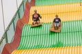 Kids on carnival slide at state fair Royalty Free Stock Photo